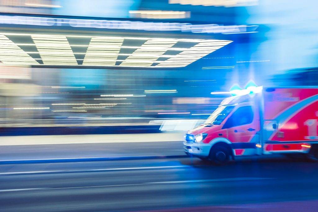 red vehicle ambulence in timelapse photography